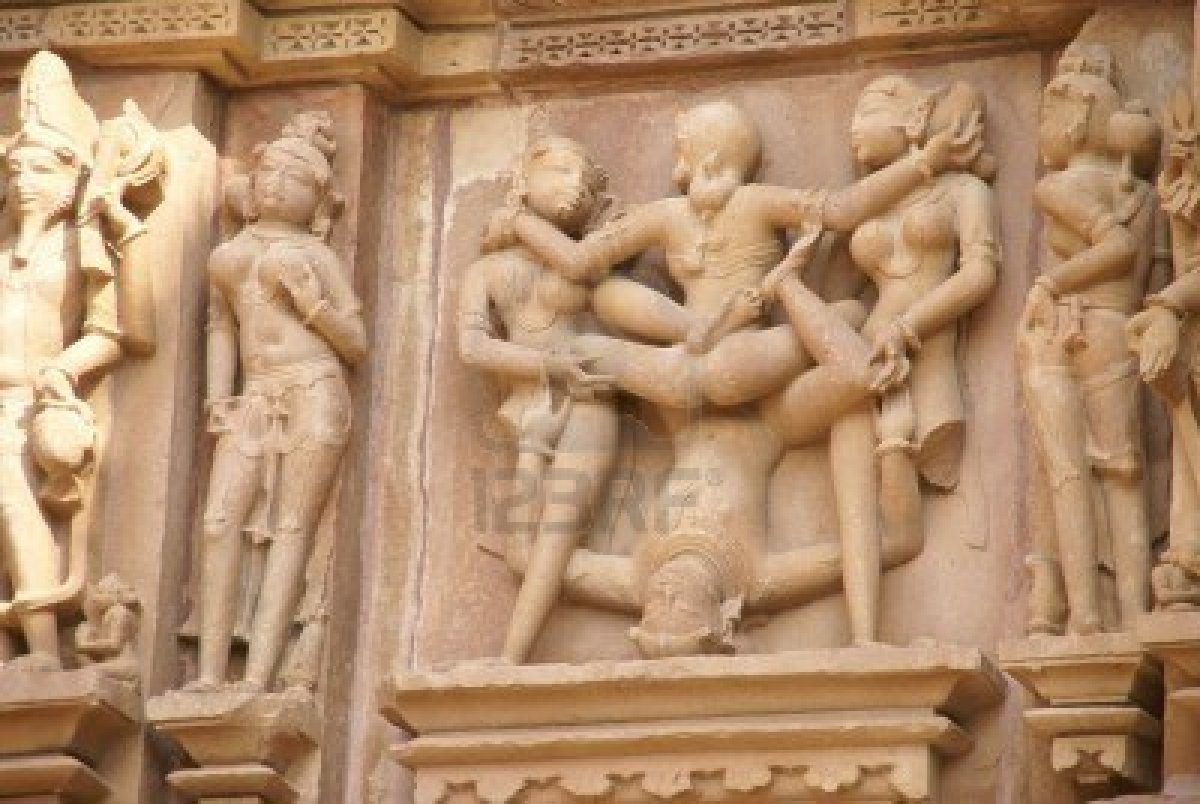 6099641-sculptures-of-loving-couples-illustrating-the-kama-sutra-on-walls-of-kandariya-mahadeva-temple-at-kh