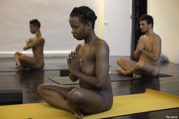 Vanessa Kennedy assumes a position during the Bold & Naked yoga class in New York