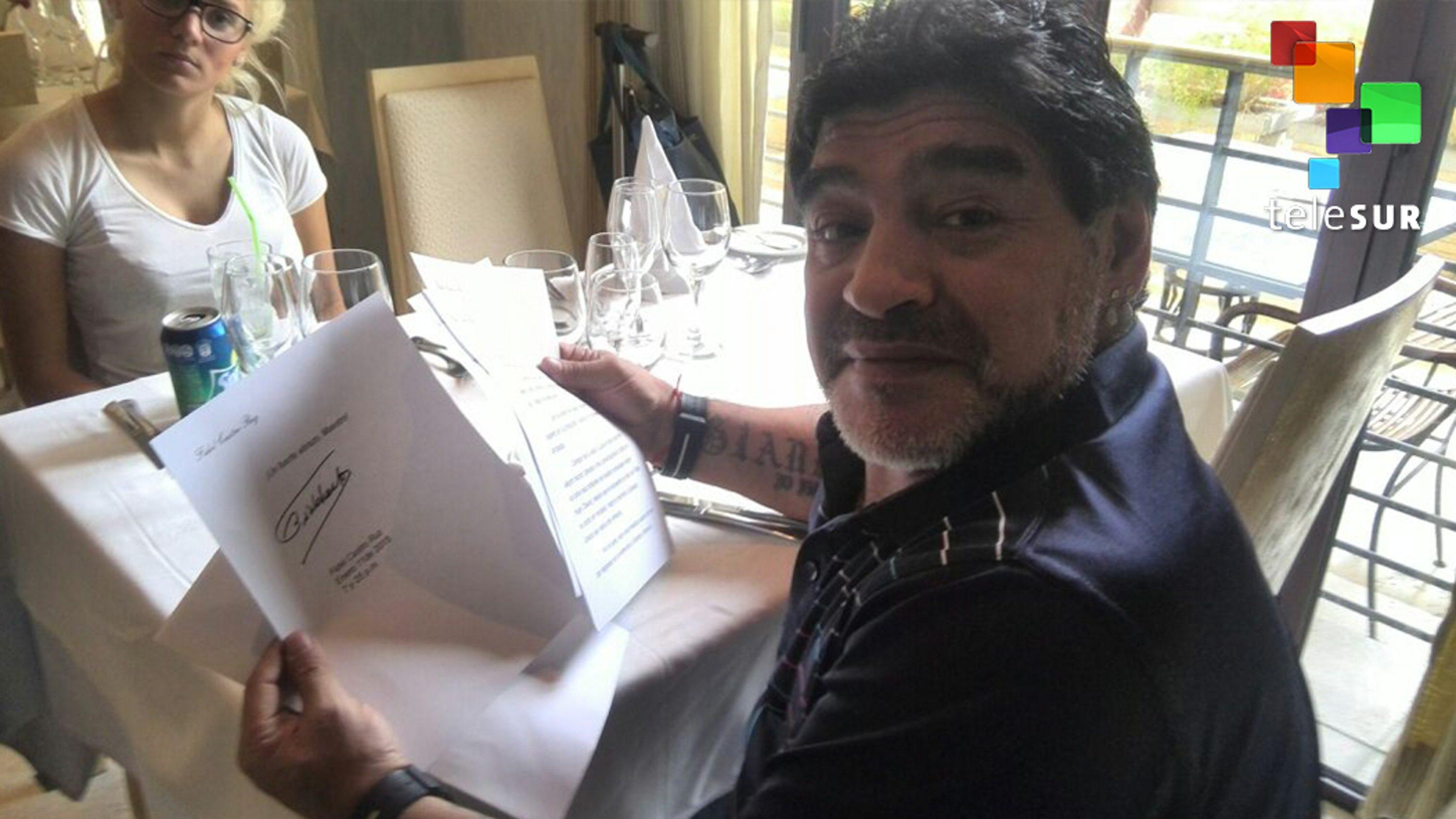Argentinean former soccer player Diego Armando Maradona receives letter from former Cuban leader Fidel Castro