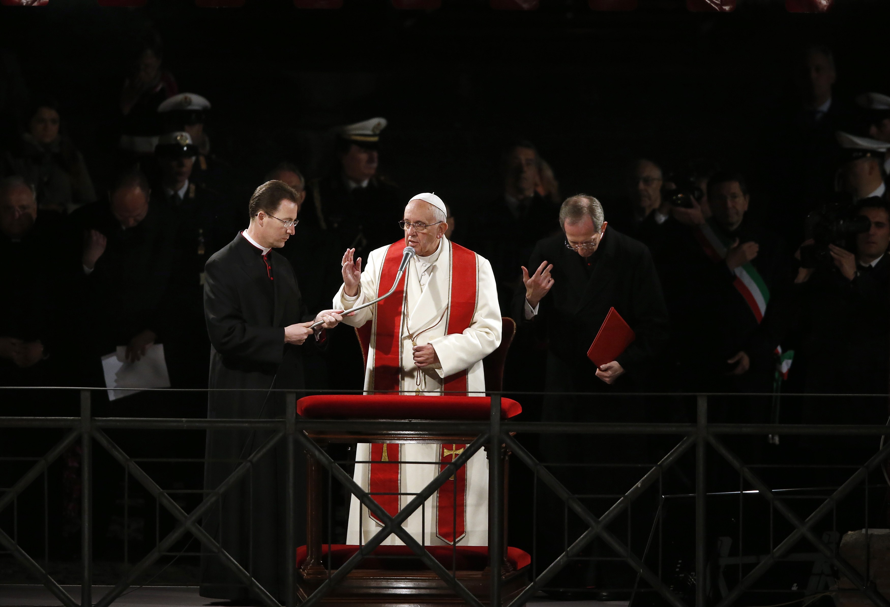 Pope Francis blesses at the end of the Via Crucis (Way of the Cross) procession during Good Friday celebrations in front of the Colosseum in Rome