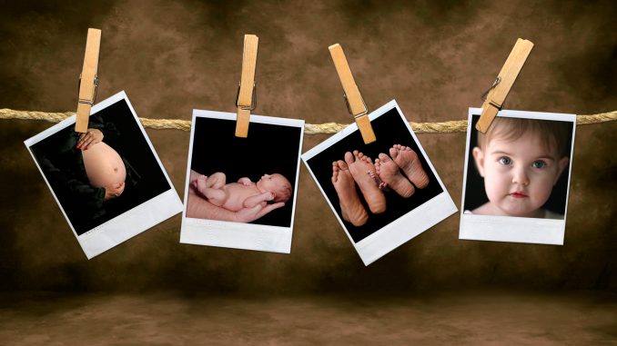 Newborn Infant and Pregnancy Shots Hanging on a Rope With Clothe