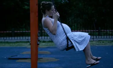 Pregnant woman on a swing 006