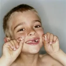 article new ehow images a07 26 ej remove baby teeth painlessly 800x800