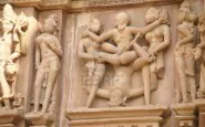 6099641 sculptures of loving couples illustrating the kama sutra on walls of kandariya mahadeva temple at kh