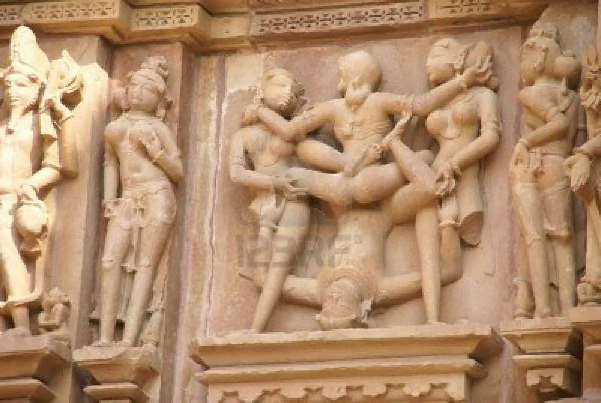 6099641-sculptures-of-loving-couples-illustrating-the-kama-sutra-on-walls-of-kandariya-mahadeva-temple-at-kh