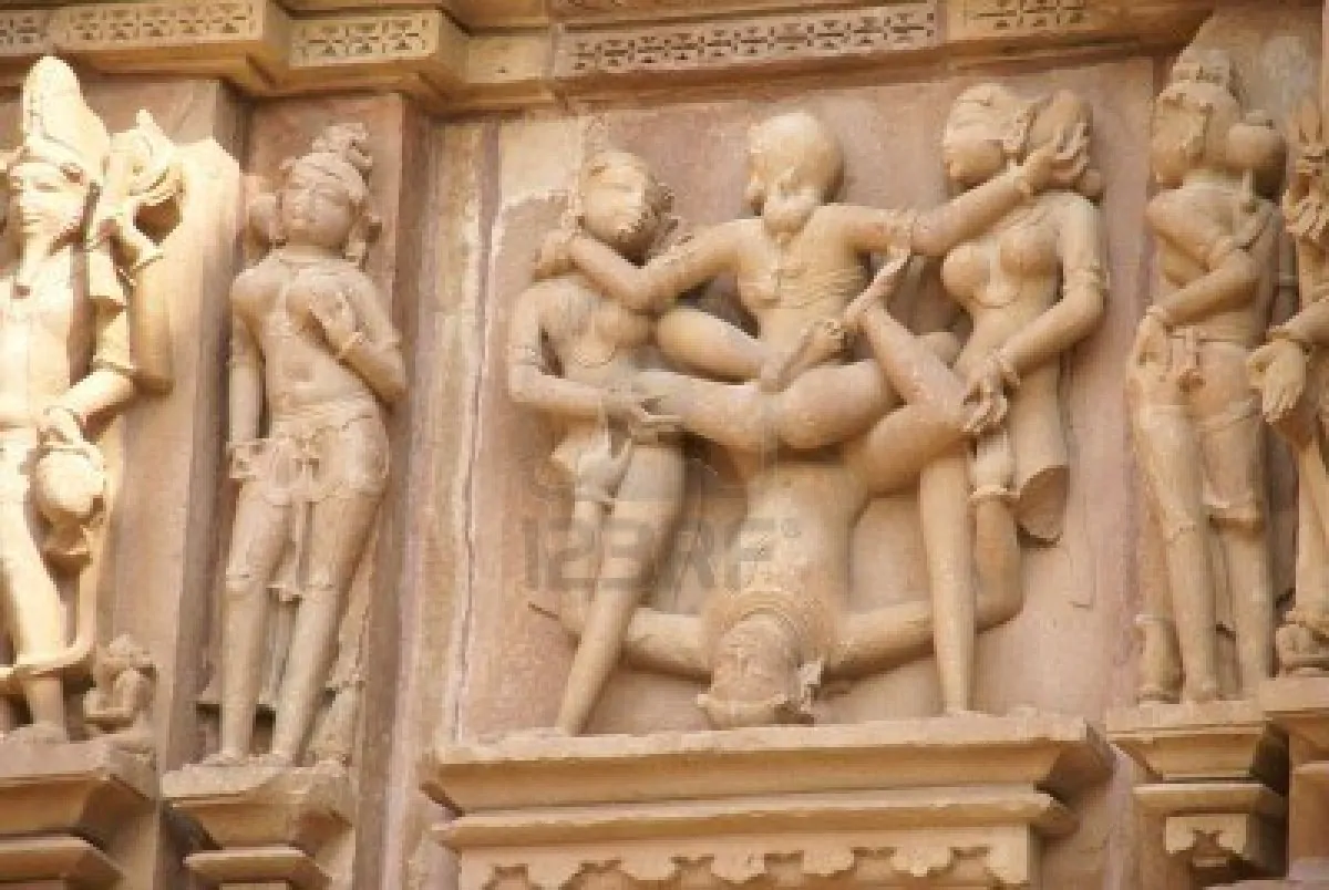 6099641 sculptures of loving couples illustrating the kama sutra on walls of kandariya mahadeva temple at kh