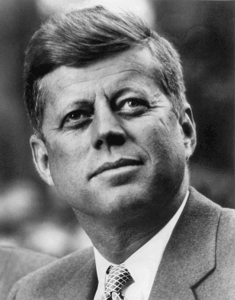 John F. Kennedy White House photo portrait looking up