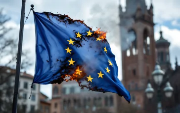 Bandiera dell'Unione Europea avvolta dalle fiamme a Bologna